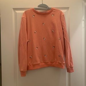 Peach sweatshirt with flowers